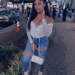 White ruffled bodysuit